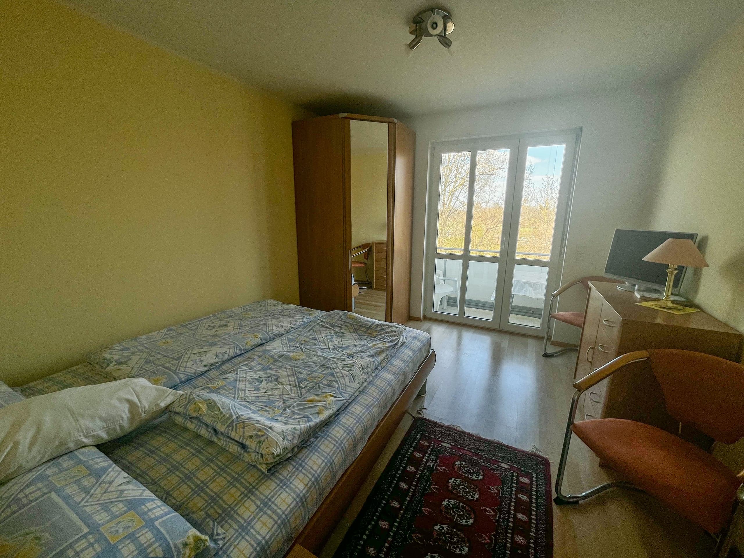 Schlafzimmer mit Balkon