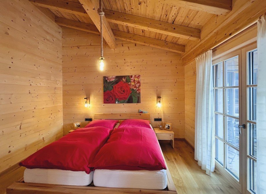 Schlafzimmer mit Bad en Suite Einfamilienhaus Unken